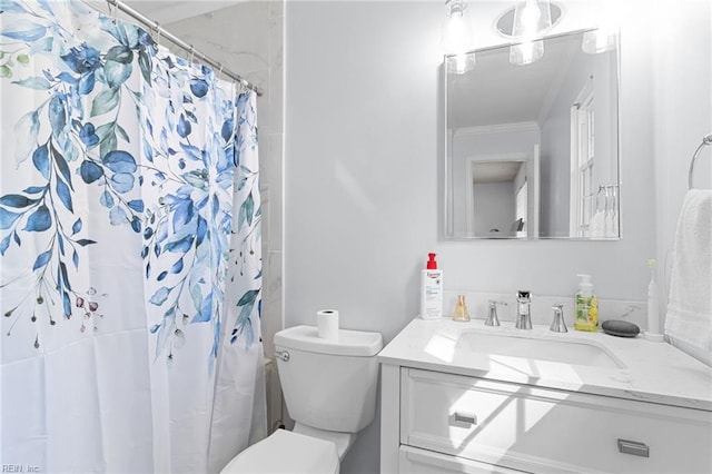 bathroom with vanity, crown molding, curtained shower, and toilet