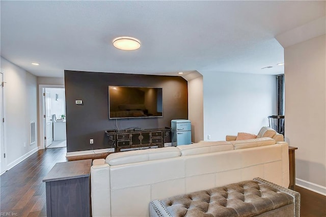 living room with dark wood finished floors, recessed lighting, baseboards, and visible vents