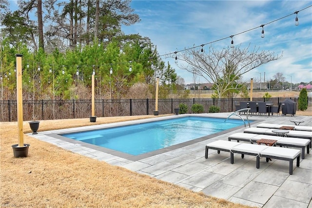 view of pool featuring a fenced in pool, a grill, a patio, and fence