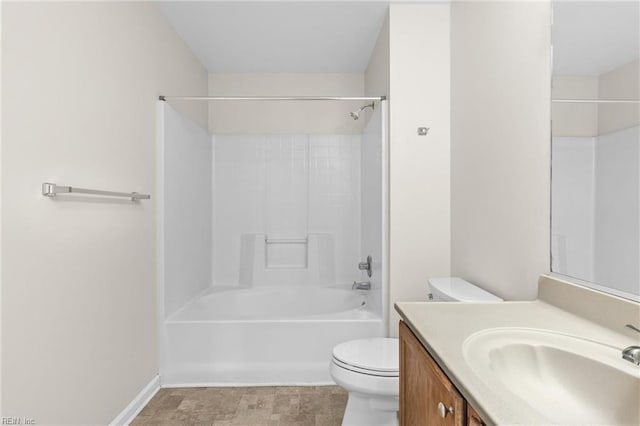 full bath featuring vanity, toilet, bathtub / shower combination, and baseboards