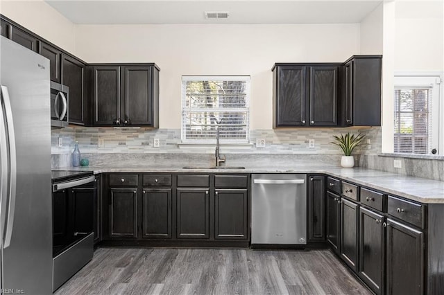 kitchen featuring a wealth of natural light, visible vents, appliances with stainless steel finishes, and a sink