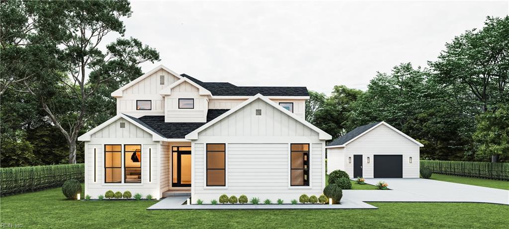 modern farmhouse with board and batten siding, a front lawn, roof with shingles, and fence