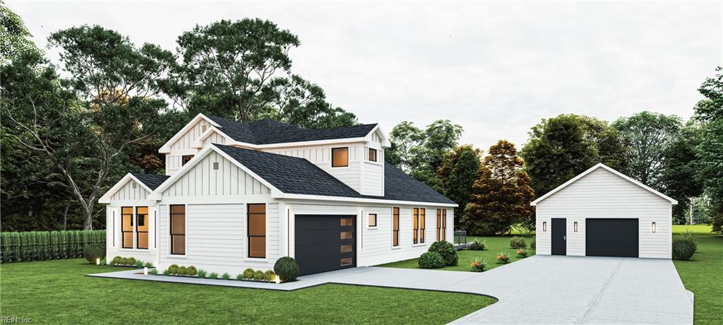 view of front of home with board and batten siding, an outdoor structure, a front yard, and a shingled roof