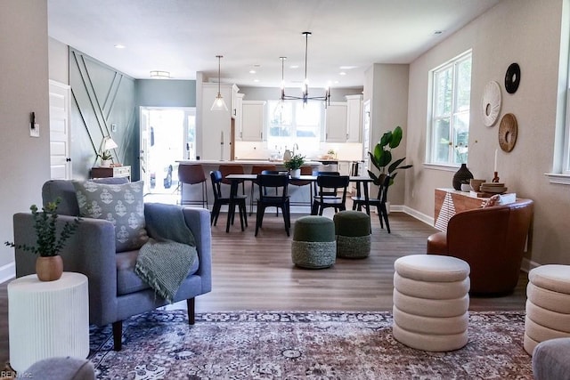 living room with baseboards and wood finished floors