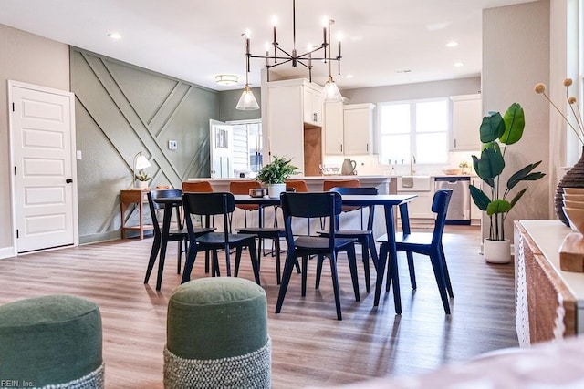 dining room with recessed lighting, a chandelier, and light wood finished floors