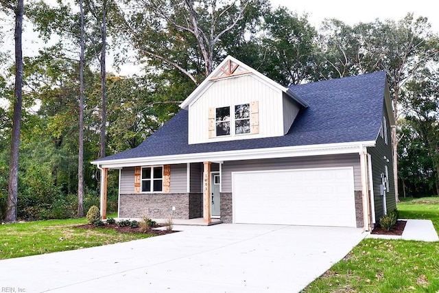 view of front of property with a front yard, brick siding, driveway, and a shingled roof