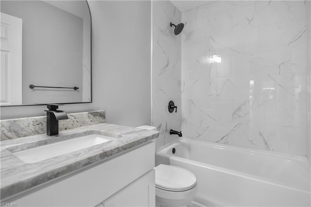 full bathroom featuring toilet, vanity, and washtub / shower combination