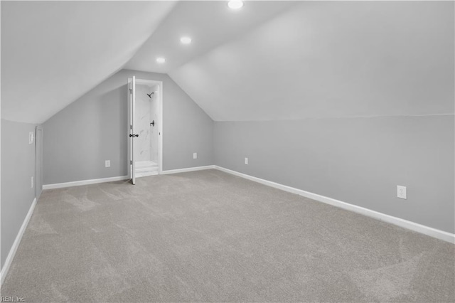 bonus room featuring recessed lighting, baseboards, carpet, and lofted ceiling