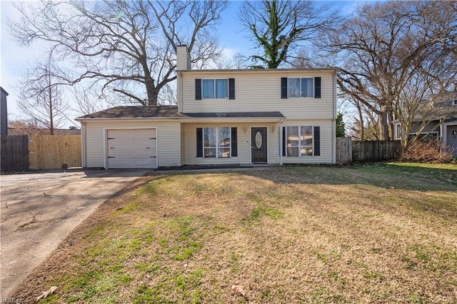 traditional home featuring a front lawn, a chimney, an attached garage, and fence