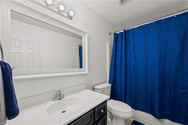 bathroom with visible vents, toilet, a textured ceiling, and vanity