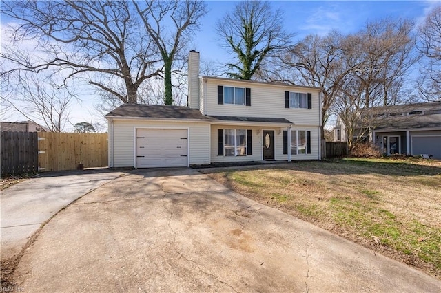 traditional home with an attached garage, fence, driveway, and a chimney