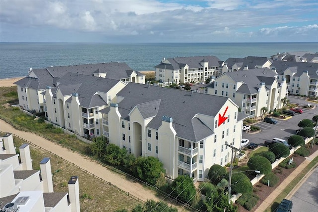 bird's eye view with a residential view and a water view