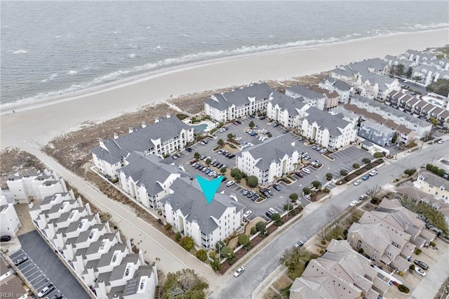 bird's eye view featuring a residential view, a beach view, and a water view