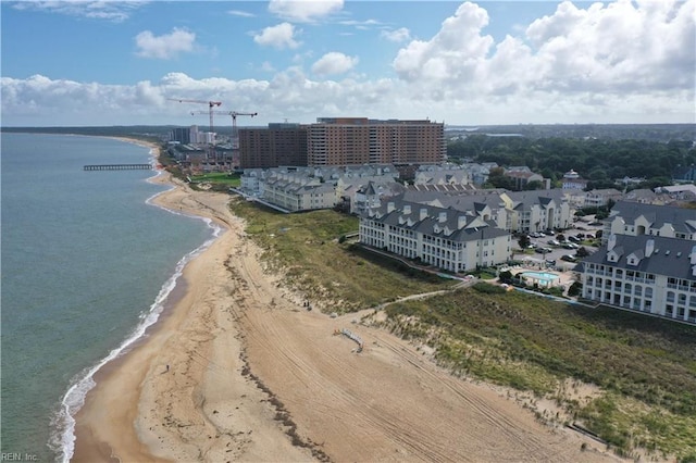 aerial view featuring a view of the beach and a water view