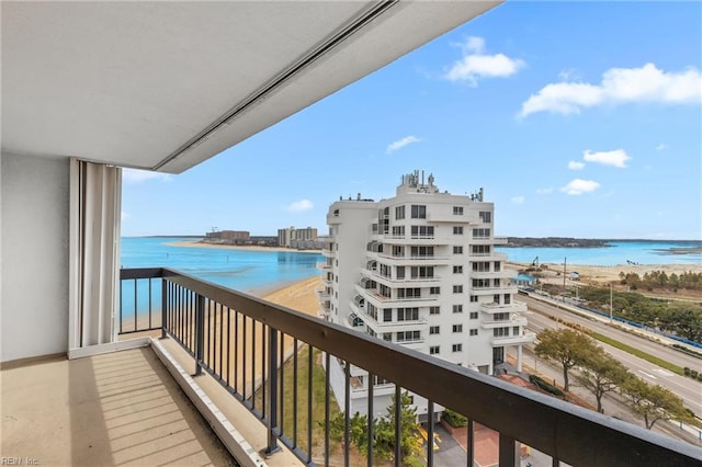 balcony featuring a water view