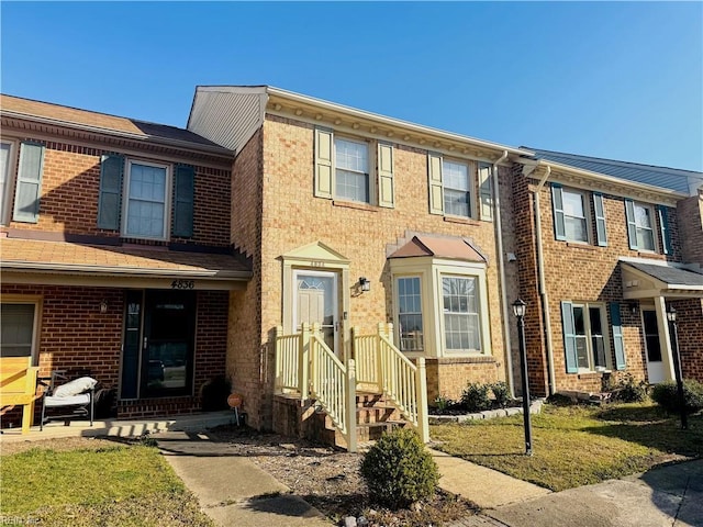 view of property with brick siding