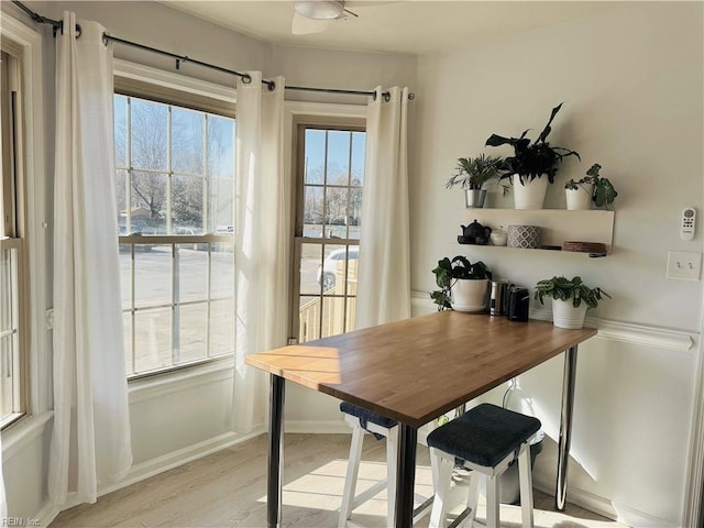 dining area featuring light wood-style flooring