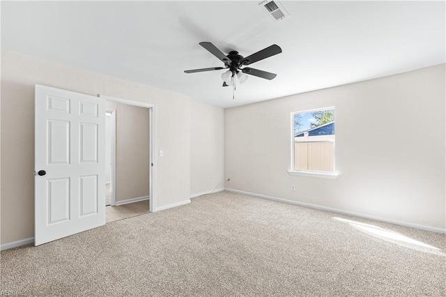 unfurnished bedroom with visible vents, carpet flooring, and baseboards