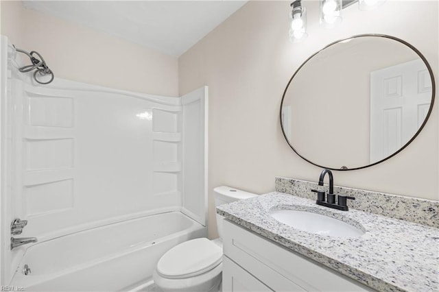 bathroom featuring toilet, bathtub / shower combination, and vanity