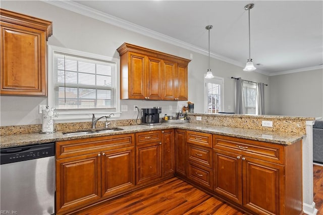 kitchen featuring a sink, stainless steel dishwasher, a peninsula, brown cabinetry, and dark wood-style flooring