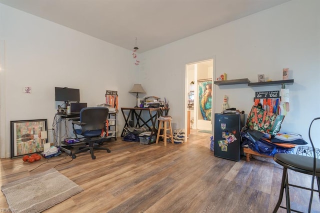 home office with wood finished floors