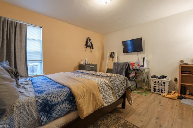 bedroom with wood finished floors