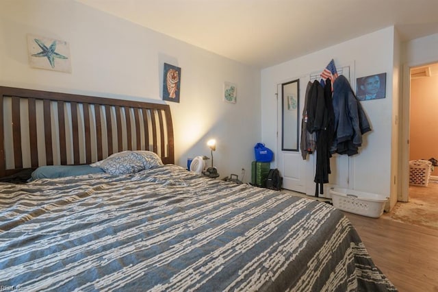 bedroom featuring wood finished floors