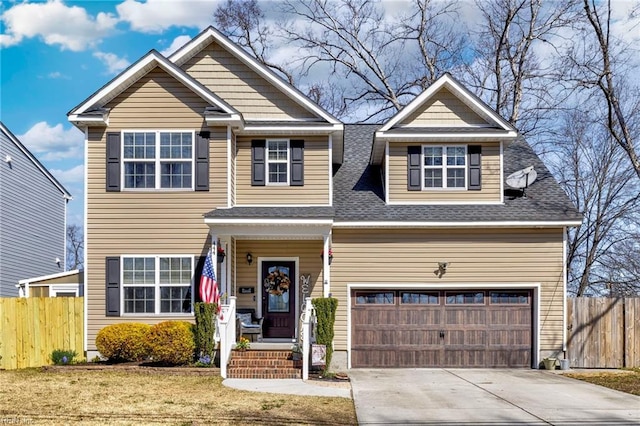 view of front of home featuring concrete driveway, fence, a front yard, and a shingled roof