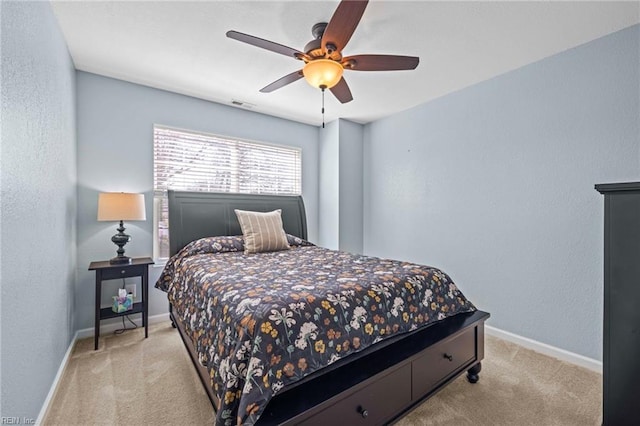 bedroom featuring a ceiling fan, carpet flooring, baseboards, and visible vents