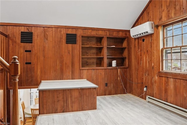 mudroom featuring wood walls, a wall mounted air conditioner, a baseboard heating unit, and lofted ceiling