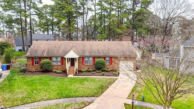 ranch-style home with driveway, a front lawn, a garage, crawl space, and brick siding