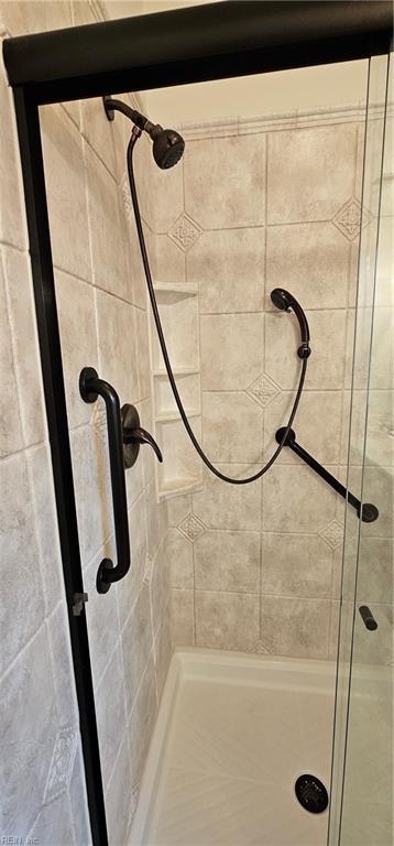 full bathroom with a stall shower