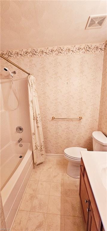 bathroom featuring vanity, toilet, shower / bathtub combination with curtain, and visible vents