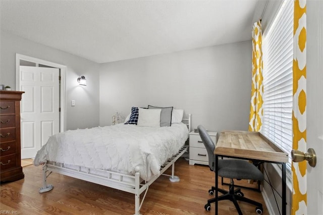 bedroom with wood finished floors