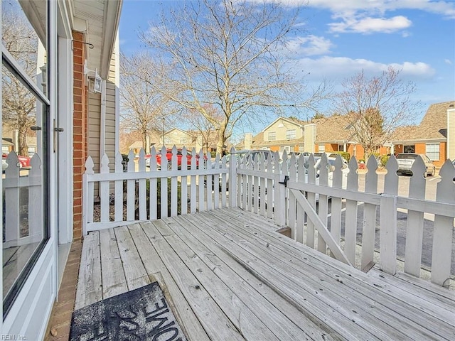 wooden terrace featuring a residential view