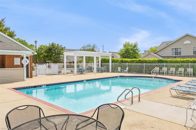 pool featuring a patio area, fence, and a pergola