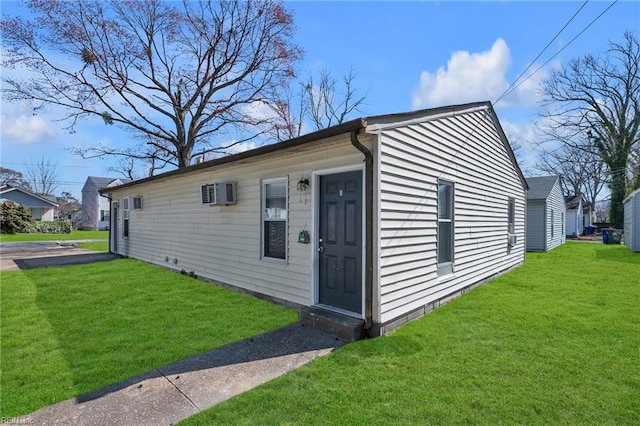 exterior space with a wall mounted air conditioner