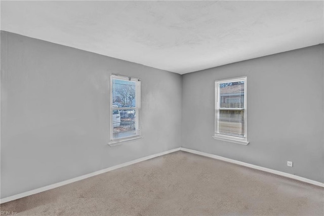 empty room with baseboards