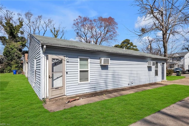 view of outbuilding featuring a wall mounted air conditioner