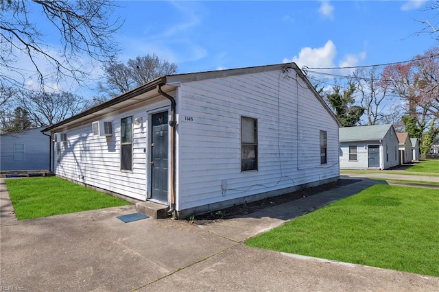 view of side of home featuring a yard