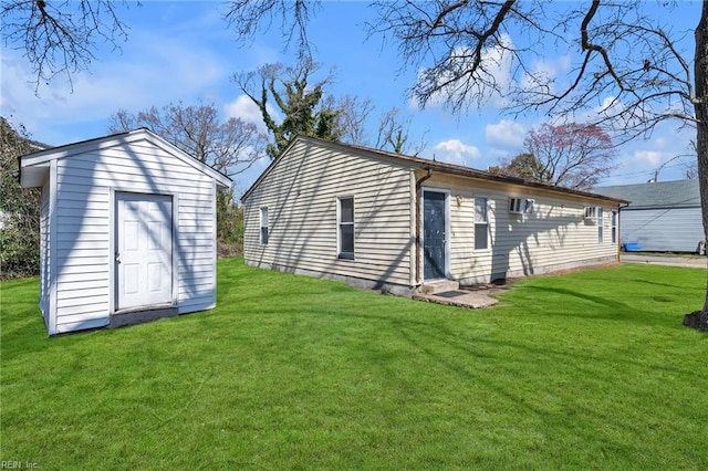 exterior space with an outbuilding and a lawn