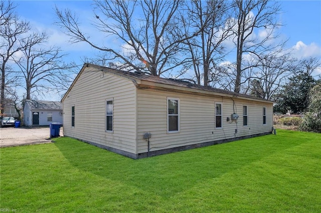 view of side of property with a yard