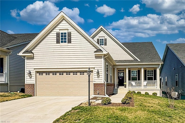 view of front of house featuring concrete driveway, a garage, covered porch, and a front lawn