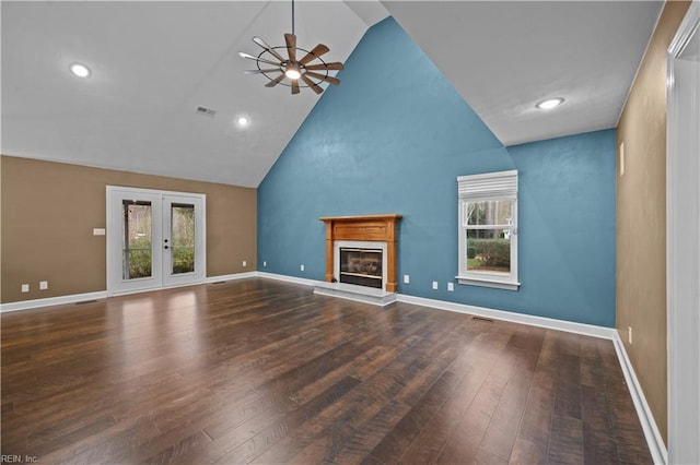 unfurnished living room featuring high vaulted ceiling, a ceiling fan, a glass covered fireplace, wood finished floors, and baseboards