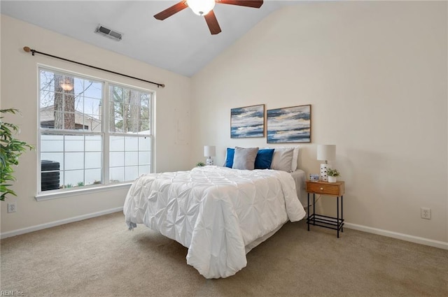 carpeted bedroom with visible vents, baseboards, ceiling fan, and vaulted ceiling