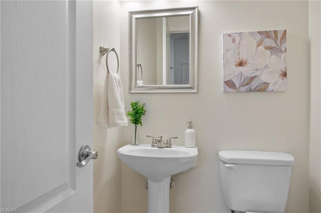 bathroom with a sink and toilet