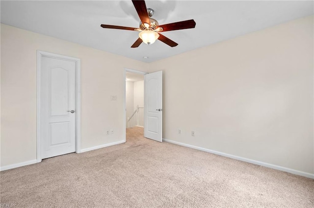 unfurnished bedroom featuring baseboards, carpet, and a ceiling fan