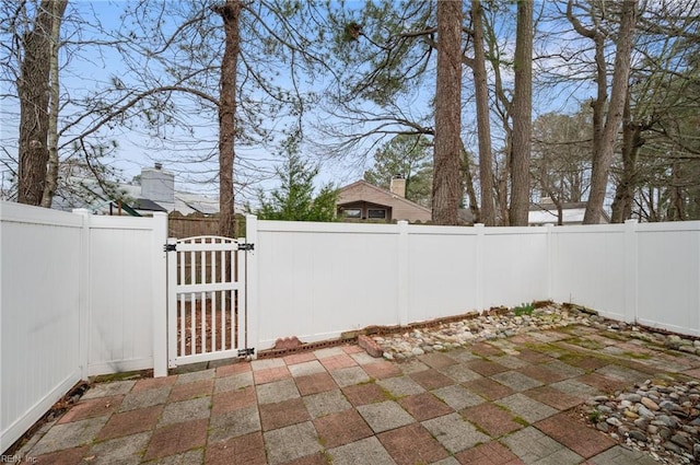 view of patio / terrace featuring a fenced backyard and a gate