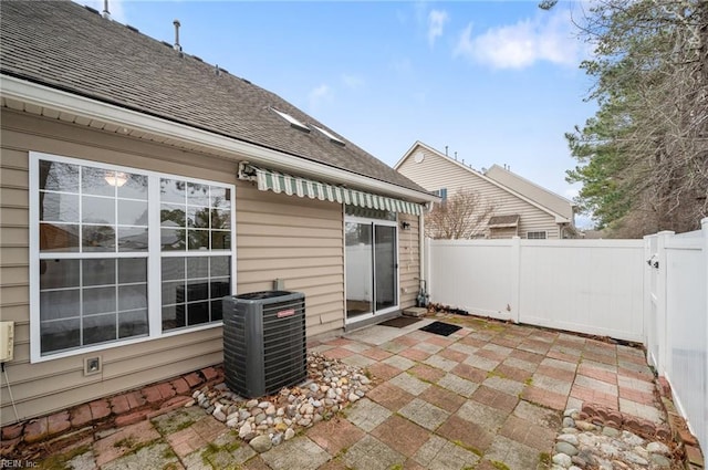 view of patio with central air condition unit and fence private yard