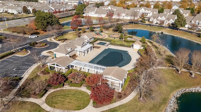 birds eye view of property with a residential view and a water view